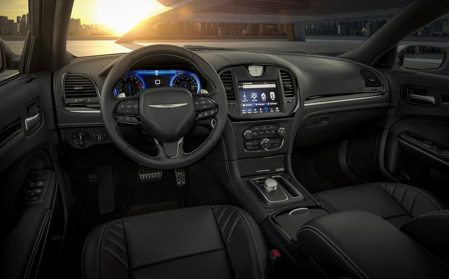 The interior of the 2023 Chrysler 300C features silver stitching that reaches the doors, console, seats and leather instrument panel, with carbon fiber and Piano Black touches on the interior bezels.